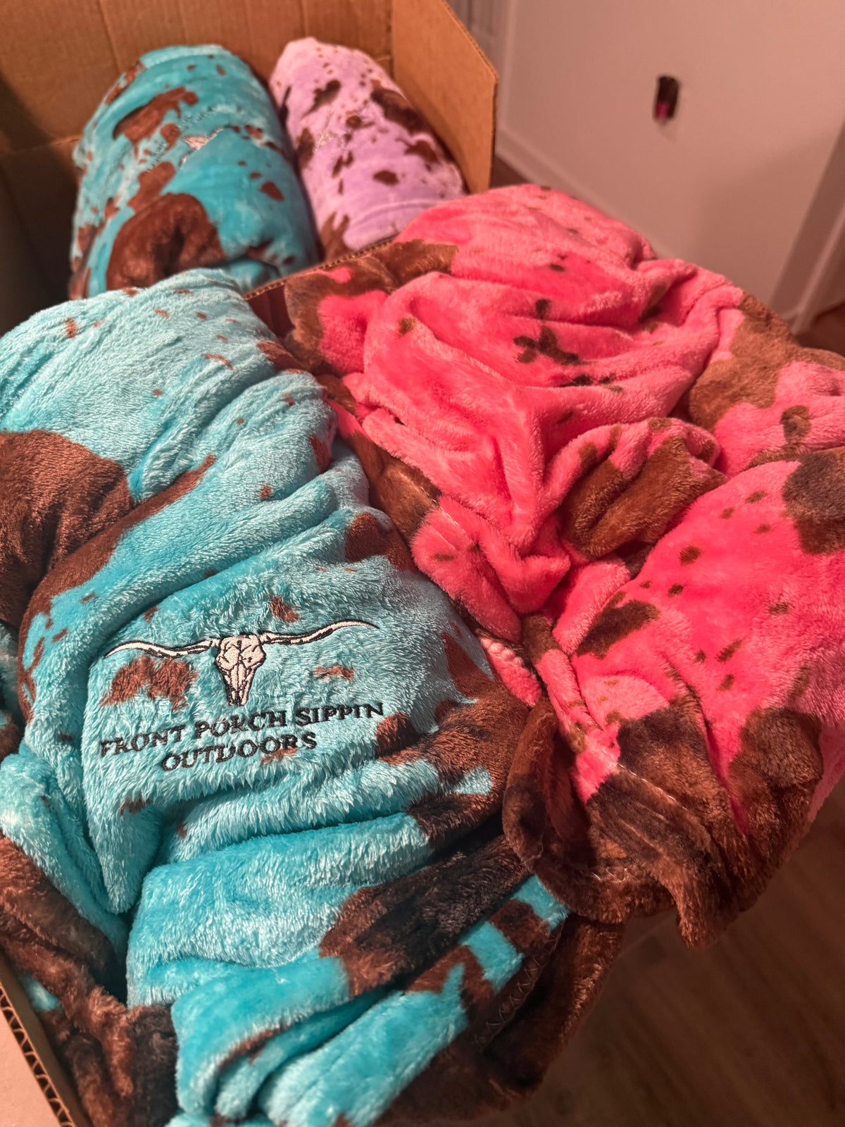 Cowhide design blanket with logo embroidered